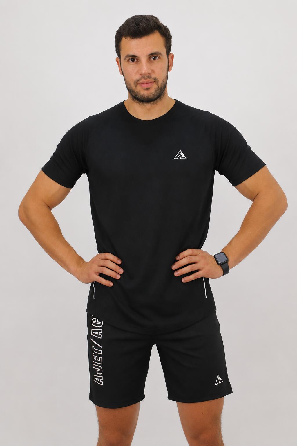 ajet-black-tshirt-pose تي شيرت Essential Meshاسود - Image 1